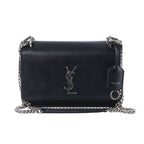 Saint Laurent Sunset black leather crossbody bag with silver-tone YSL logo, chain strap, flap front and leather tag.