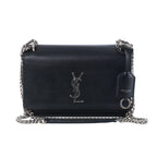 Saint Laurent Sunset black leather crossbody bag with silver-tone YSL logo, chain strap, flap front and leather tag.