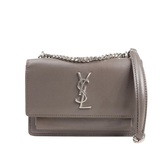 Saint Laurent Paris Sunset shoulder bag in smooth gray leather featuring silver YSL logo hardware, flap closure, and silver-tone chain strap, model 452157.