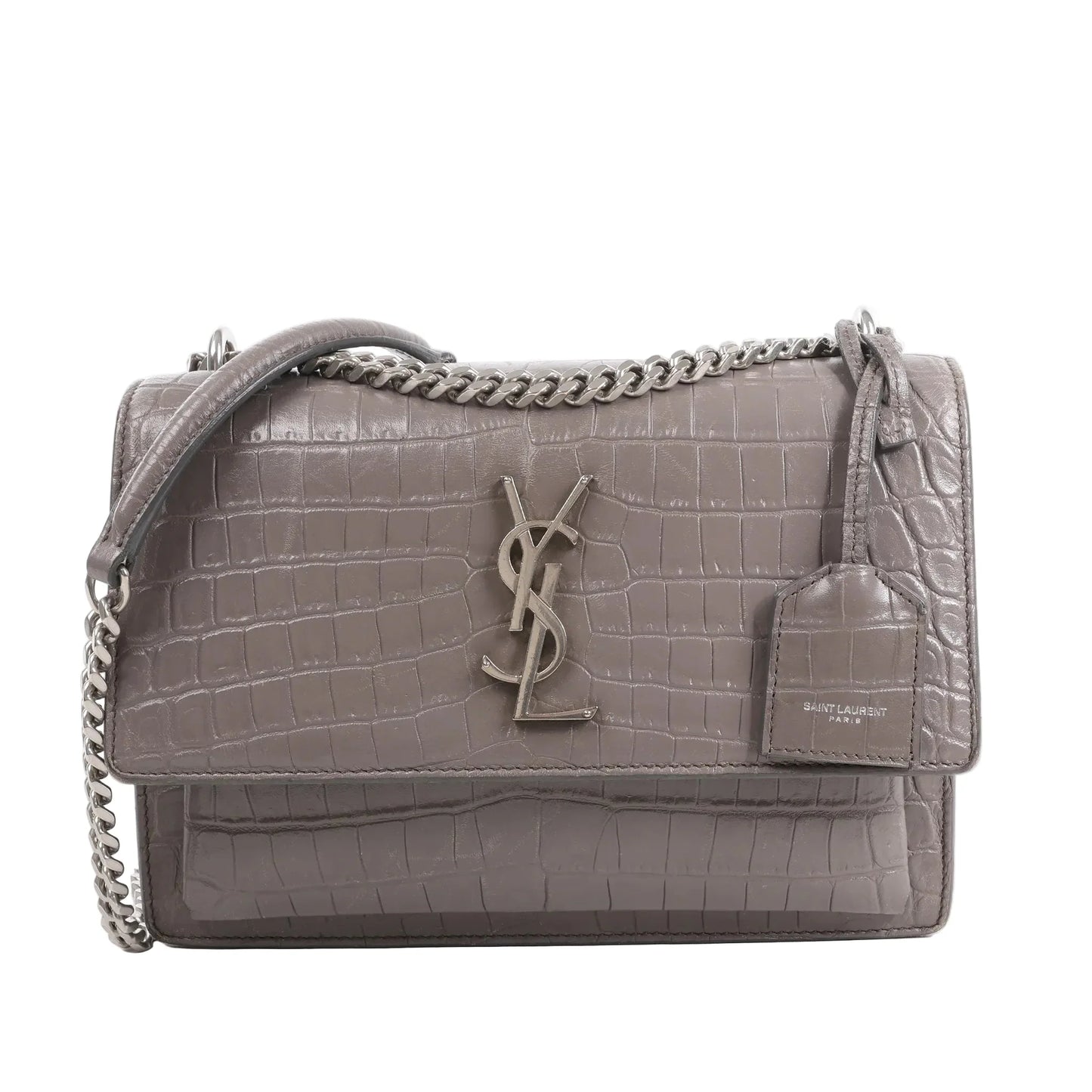 Front view of the Saint Laurent Paris Sunset Medium Mock Croc Shoulder Bag in gray, showcasing embossed crocodile-textured leather, silver-tone YSL logo hardware, chain shoulder strap, and leather tag detail, set against a white background.