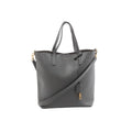 Gray Saint Laurent Toy Shopping leather tote with top handles, detachable shoulder strap, gold-tone hardware, and hanging YSL charm.