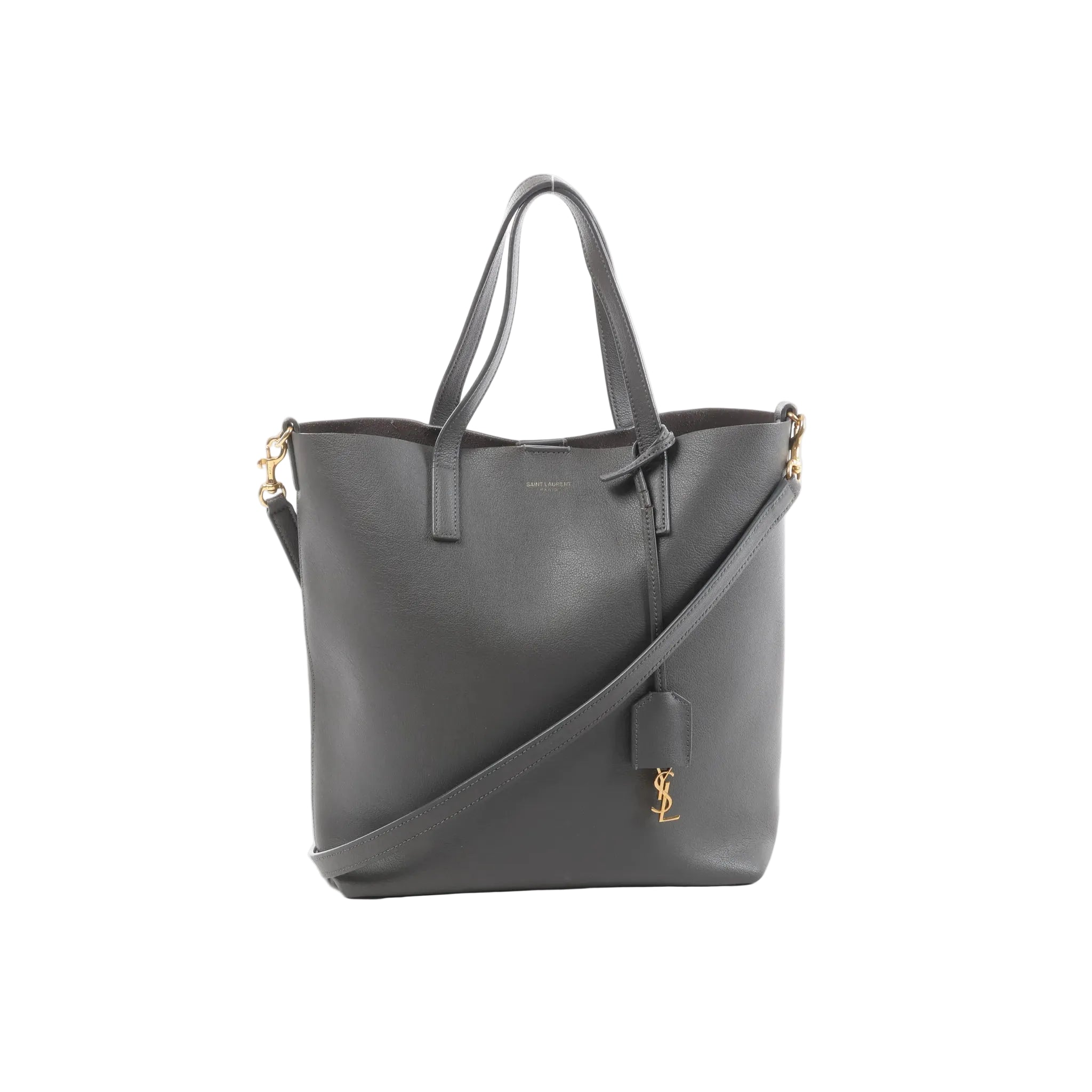 Gray Saint Laurent Toy Shopping leather tote with top handles, detachable shoulder strap, gold-tone hardware, and hanging YSL charm.