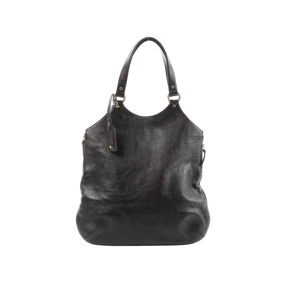 Saint Laurent Tribute Large brown leather shoulder bag with long shoulder straps, gold-tone ring hardware, and hanging leather tag on a white background.