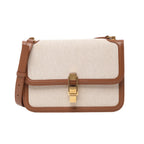 Front view of Saint Laurent Paris Carré Shoulder Bag 647713 in beige canvas with brown leather trim, featuring gold-tone clasp closure, adjustable shoulder strap, and structured rectangular design against a white background.