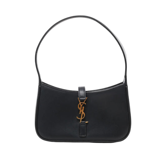 Front view of Saint Laurent Paris Le 5 à 7 Mini Hobo Handbag 710318 in black smooth leather with short handle and gold-tone YSL logo accent on the front, displayed against a white background.