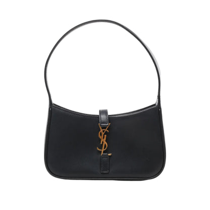 Front view of Saint Laurent Paris Le 5 à 7 Mini Hobo Handbag 710318 in black smooth leather with short handle and gold-tone YSL logo accent on the front, displayed against a white background.