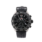 TAG Heuer Formula 1 watch with black chronograph dial, stainless steel case, black rubber strap, date window and tachymeter bezel.