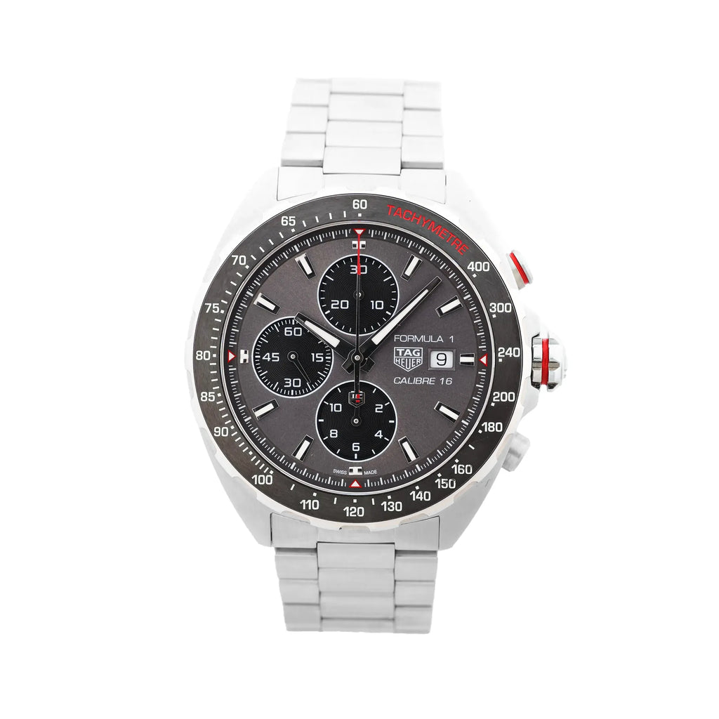 TAG Heuer Formula 1 Calibre 16 stainless steel chronograph watch with gray dial, three subdials, date window, tachymeter bezel, and steel bracelet with red accents.