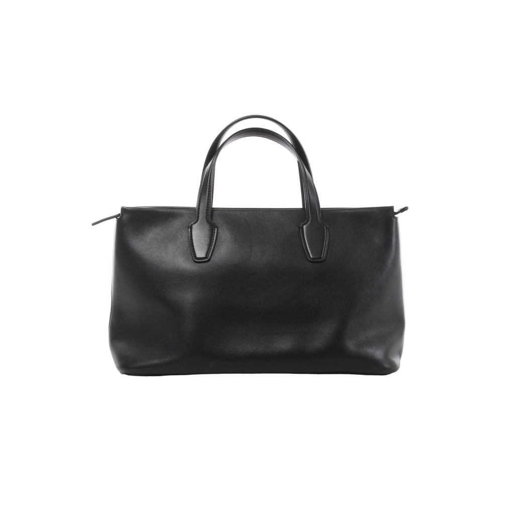 Black The Row Marcel leather bag with smooth finish, elongated double handles, softly structured rectangular shape and minimal detailing.