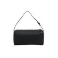 Front view of The Row 90’s black grained leather handbag with an elongated rectangular shape, slim buckled strap and top zip closure.