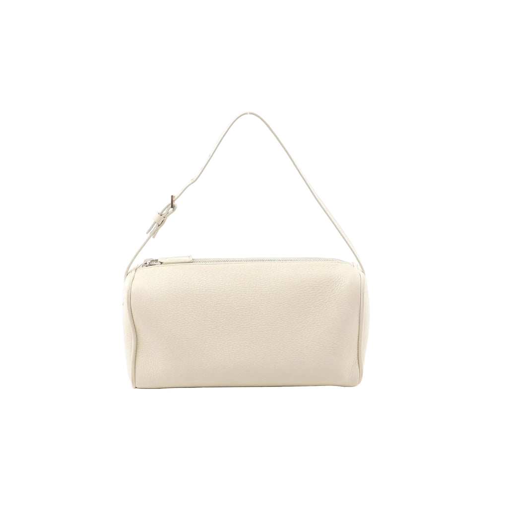White leather The Row 90’s handbag with zip-top closure, slim shoulder strap, and smooth rectangular silhouette on a white background.