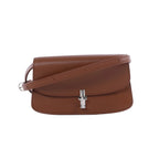 The Row Sofia leather shoulder bag with structured flap, slim adjustable strap and silver-tone front clasp.