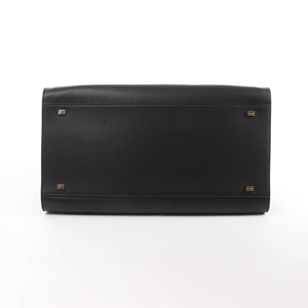 The Row Soft Margaux 15 Leather Handbag in Black