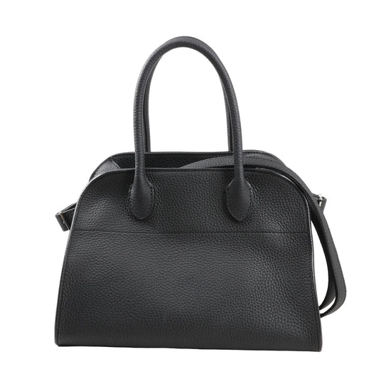 The Row Soft Margaux 10 handbag in black grained leather featuring a softly structured shape, dual top handles, and detachable shoulder strap for versatile carrying.