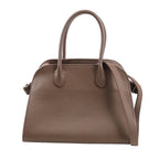 The Row Soft Margaux 10 handbag in brown grained leather featuring a softly structured shape, dual top handles, and a detachable shoulder strap for 2-way wear.