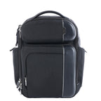 Tumi Arrivé Barker black fabric backpack with multiple front zip compartments, structured black trim, silver-tone zippers and top carry handle.