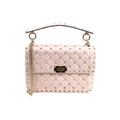 Pink Valentino Garavani Rockstud Spike leather bag with diamond quilting, pyramid studs, studded top handle, chain strap and turn-lock closure.