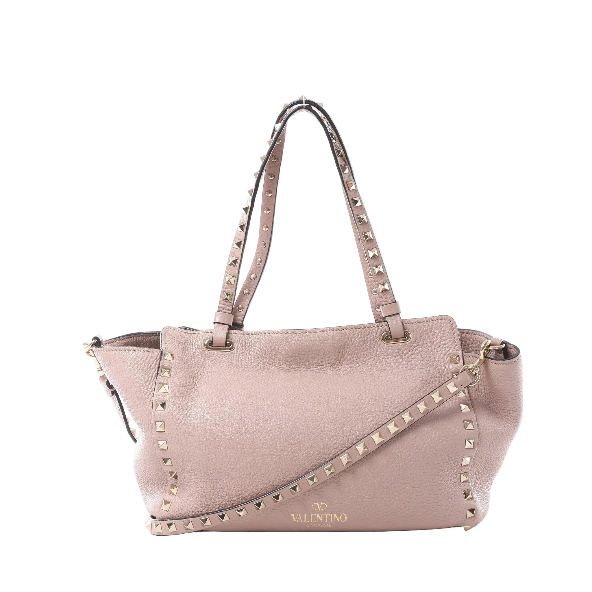 Valentino Garavani Rockstud handbag in dusty pink grained leather with gold-tone pyramid studs, dual top handles, detachable shoulder strap and gold logo on a white background.