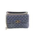 Navy Valentino Rockstud Spike quilted leather bag with pyramid studs, top handle, turn-lock closure, and gold-tone chain strap.