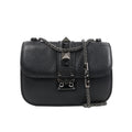 Valentino Rockstud Glam Lock shoulder bag in black grained leather with pyramid stud accents, flap closure with metal lock, and silver-tone chain strap against a white background.