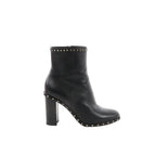 Black Valentino Garavani leather ankle boot with chunky block heel and pyramid Rockstud trim along the top edge and sole welt, shown in side profile.
