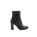 Black Valentino Garavani leather ankle boot with chunky block heel and pyramid Rockstud trim along the top edge and sole welt, shown in side profile.