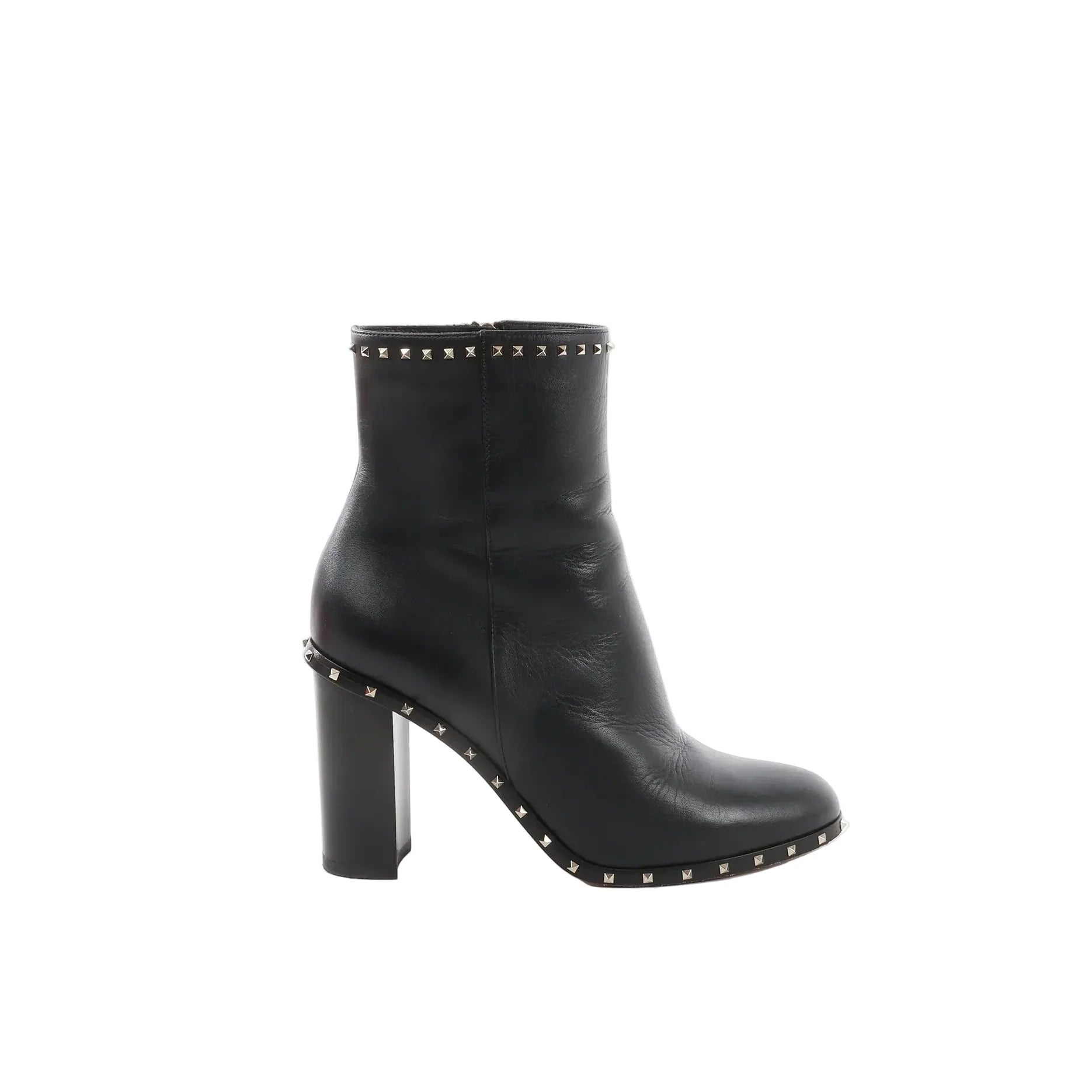 Black Valentino Garavani leather ankle boot with chunky block heel and pyramid Rockstud trim along the top edge and sole welt, shown in side profile.