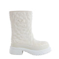 White Valentino Garavani rain boot with raised floral petal texture and chunky platform lug sole on a white background.