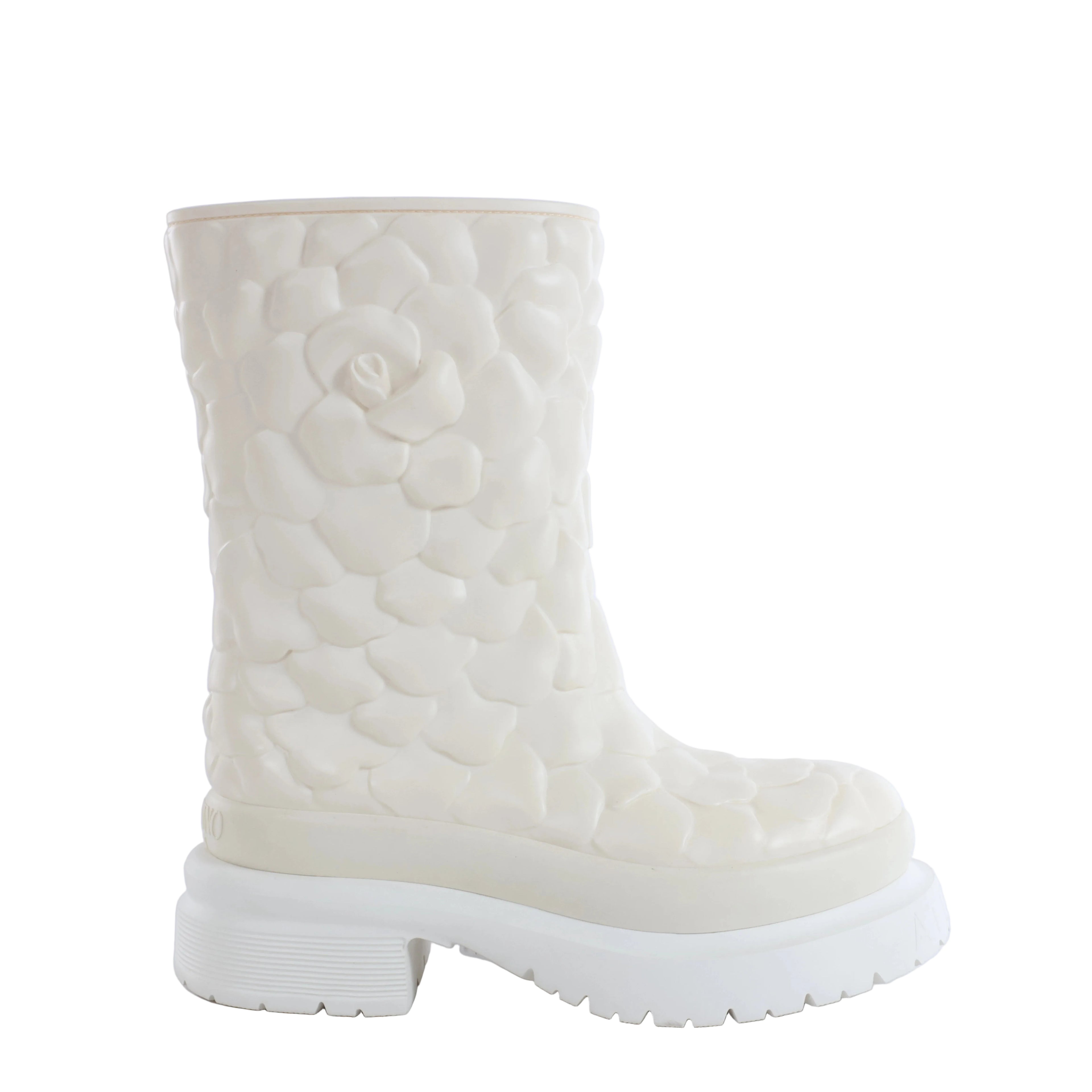 White Valentino Garavani rain boot with raised floral petal texture and chunky platform lug sole on a white background.