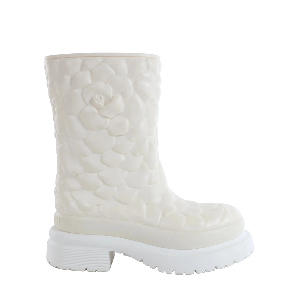 White Valentino Garavani rain boot with raised floral petal texture and chunky platform lug sole on a white background.