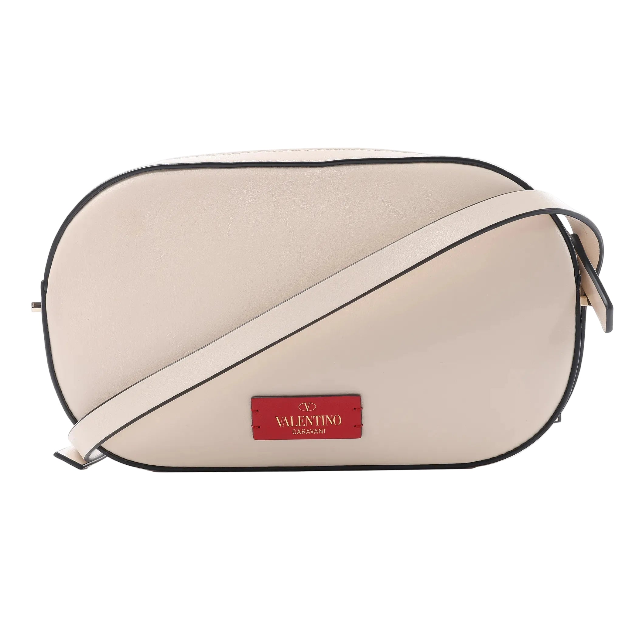 Valentino Garavani crossbody bag in pale pink leather with black edge trim, slim shoulder strap and red logo patch on the front.