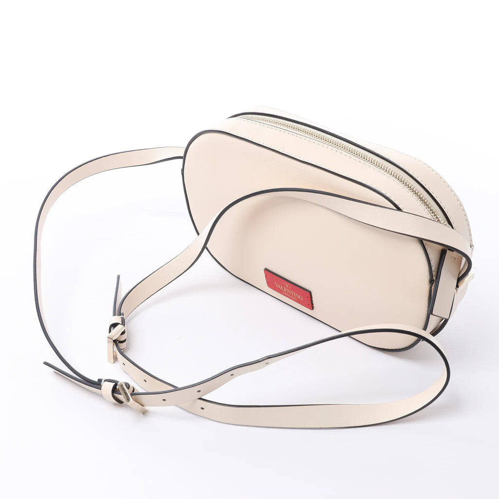 Valentino Garavani V logo Leather Crossbody Bag in Pink