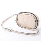 Valentino Garavani V logo Leather Crossbody Bag in Pink