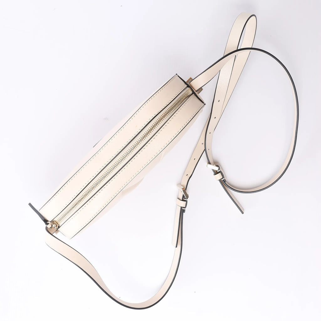 Valentino Garavani V logo Leather Crossbody Bag in Pink