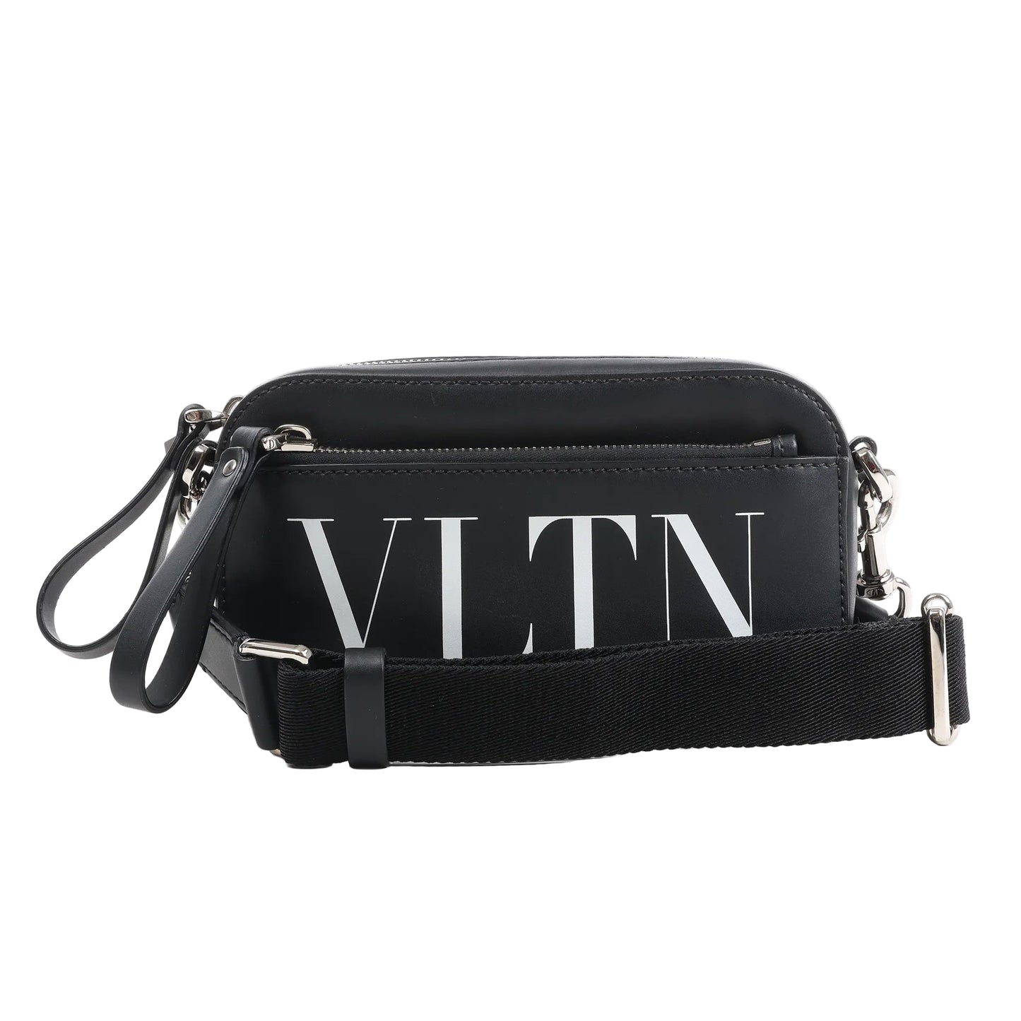 Front view of the Valentino Garavani VLTN Leather Shoulder Bag in black, featuring smooth leather exterior, bold white VLTN logo print, front zip pocket, detachable black fabric strap, and silver-tone hardware, displayed against a white background.