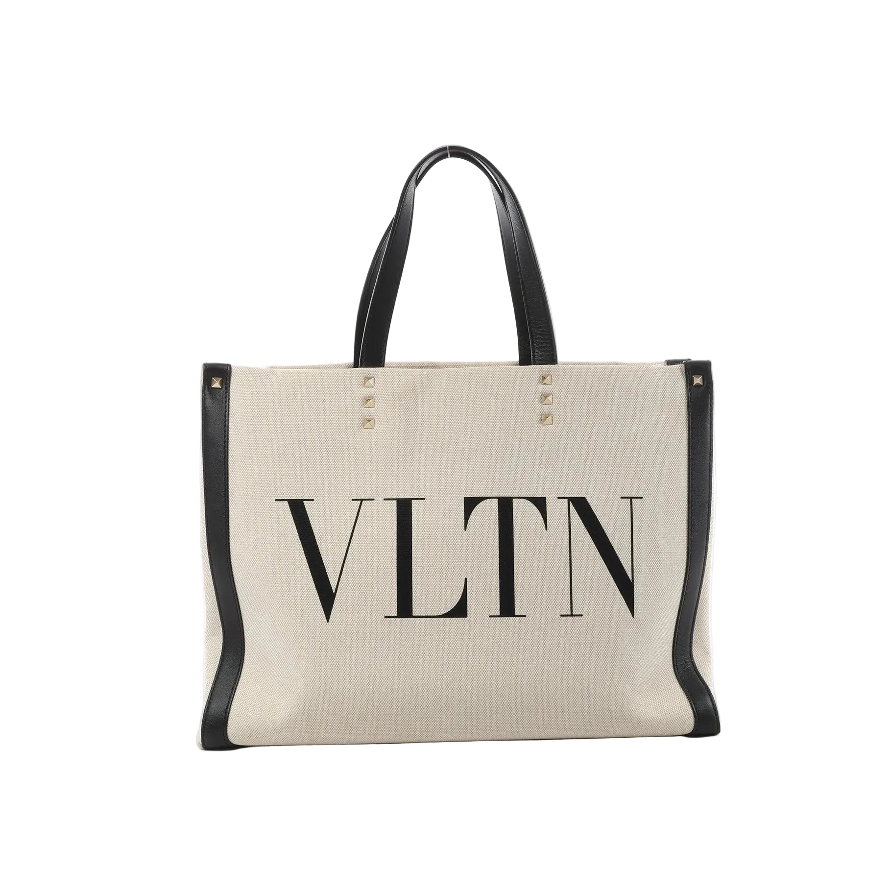 Valentino Garavani VLTN beige canvas tote bag with black leather trim, black top handles, stud details, and large black VLTN logo print on the front.