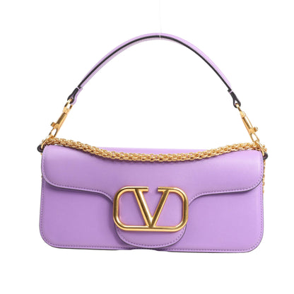 Valentino Garavani VLogo Loco 2Way Handbag in purple leather featuring a structured silhouette, gold-tone chain strap, top handle, and oversized VLogo front hardware.