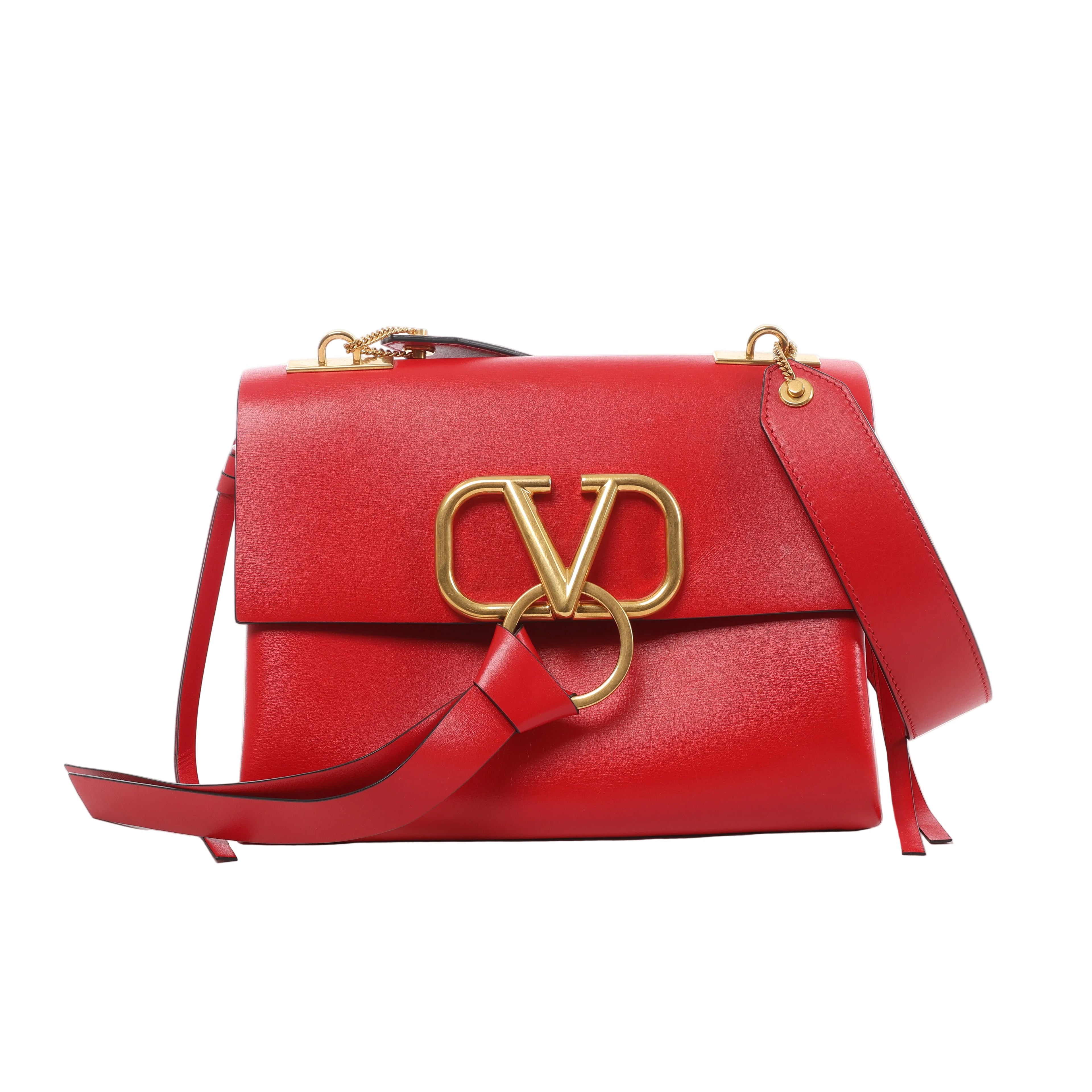 Red Valentino Garavani VRing leather shoulder bag with flap front, oversized gold-tone V logo and ring hardware, and wide leather shoulder strap.