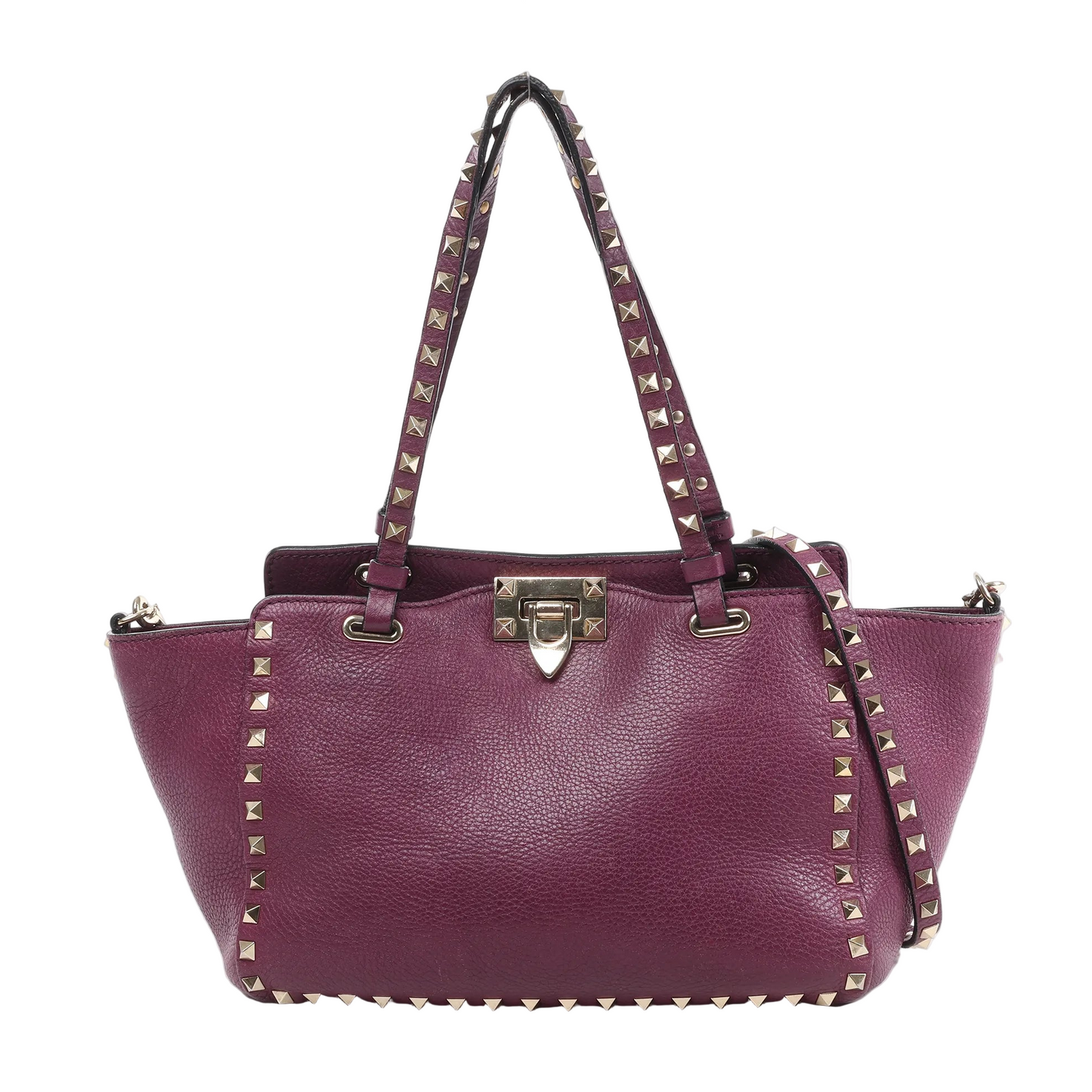 Valentino Garavani Rockstud 2-Way handbag in burgundy grained leather with gold-tone pyramid stud trim, dual top handles, detachable shoulder strap, and clasp closure against a white background.
