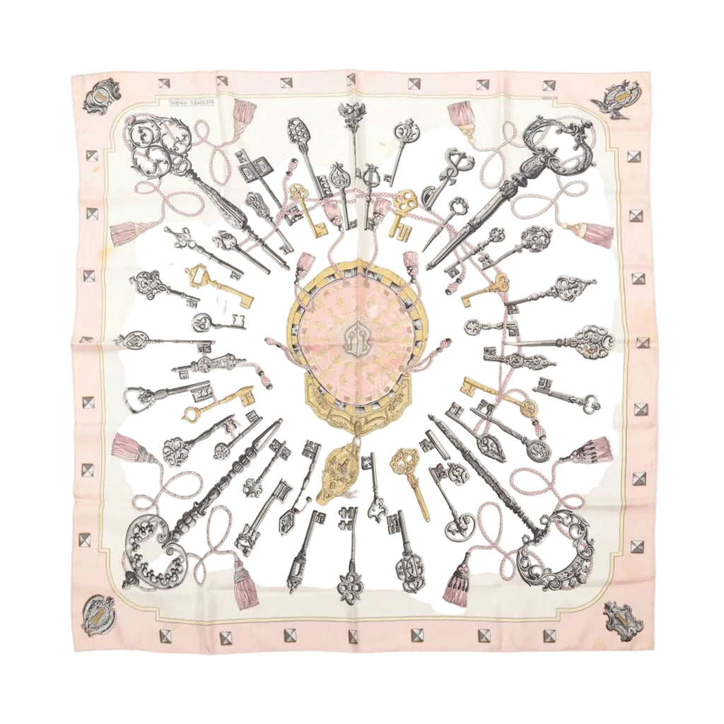 Hermès square scarf in pale pink with intricate black, grey and gold-tone key, chain and ornamental print.