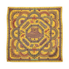 Hermès Parures des Maharajas Carré Géant scarf in golden yellow with intricate multicolour jewel and ornamental motifs.