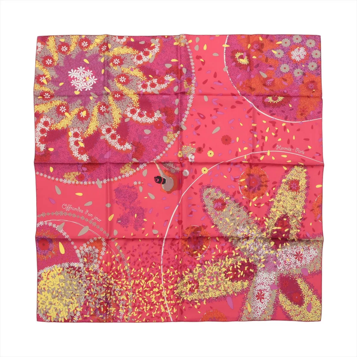 Red and pink Hermès Carré 90 silk scarf laid flat with multicolour floral, foliage and abstract patterned motifs.