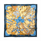 Hermès Carré 90 Soleil de Soie silk scarf with navy border, gold background, blue central bow and detailed equestrian motifs.