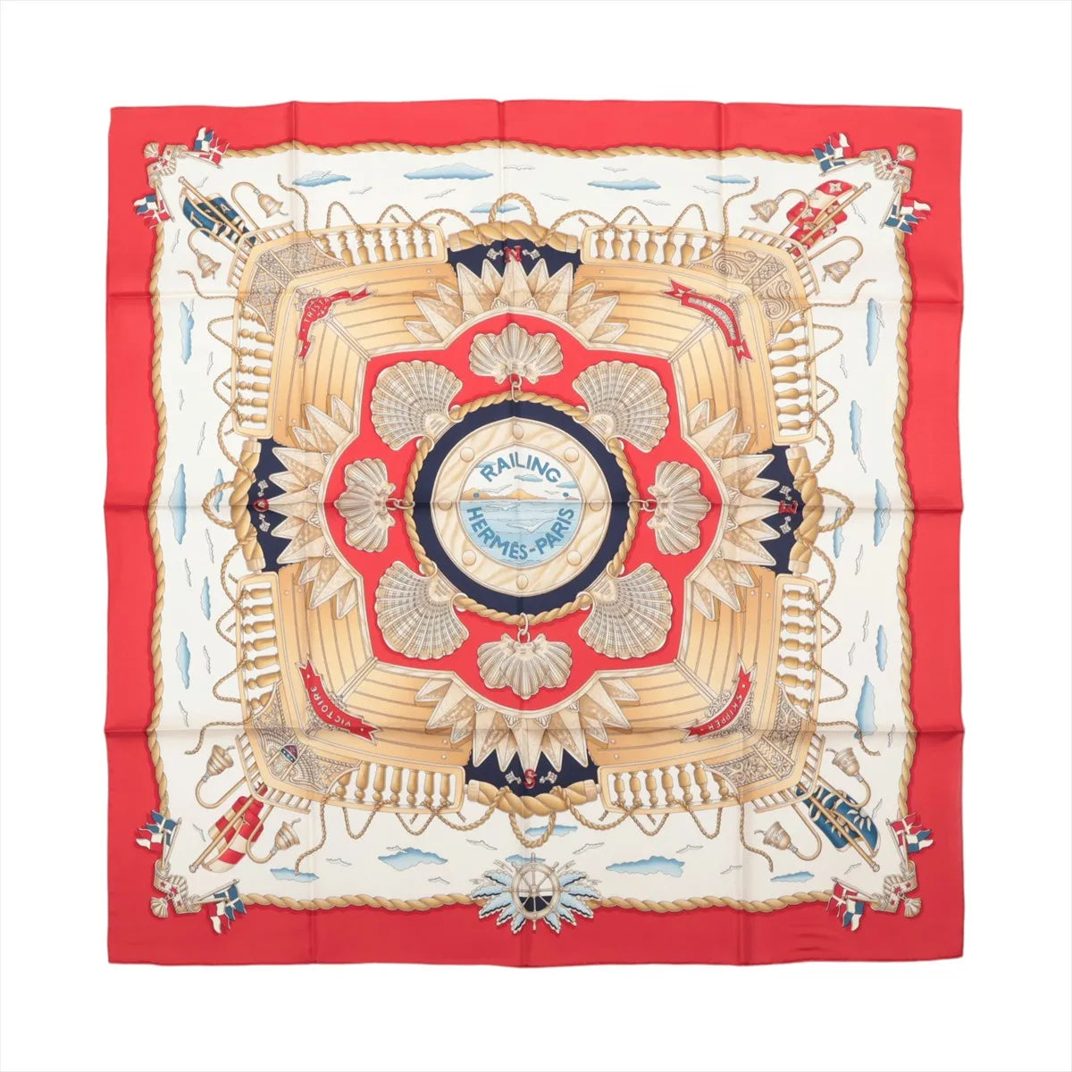 Hermès Carré 90 Railing silk scarf with red border, cream center, gold shell motifs, ropes, railings and navy nautical details.
