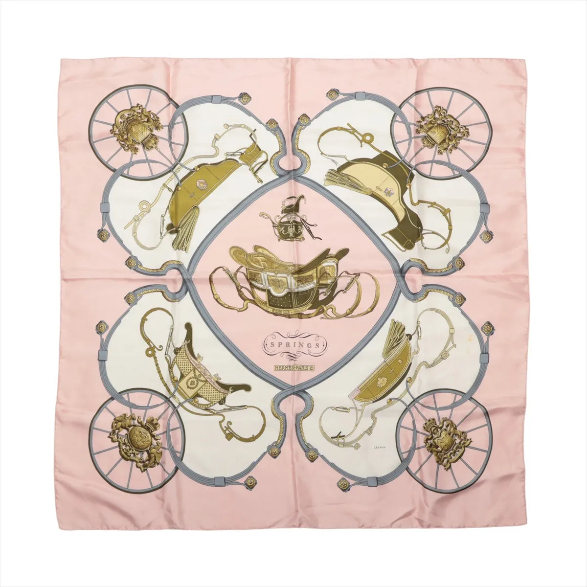 Hermès Carré 90 Springs pink silk scarf with cream panels, gold saddles, gray carriage wheels and symmetrical equestrian motifs.