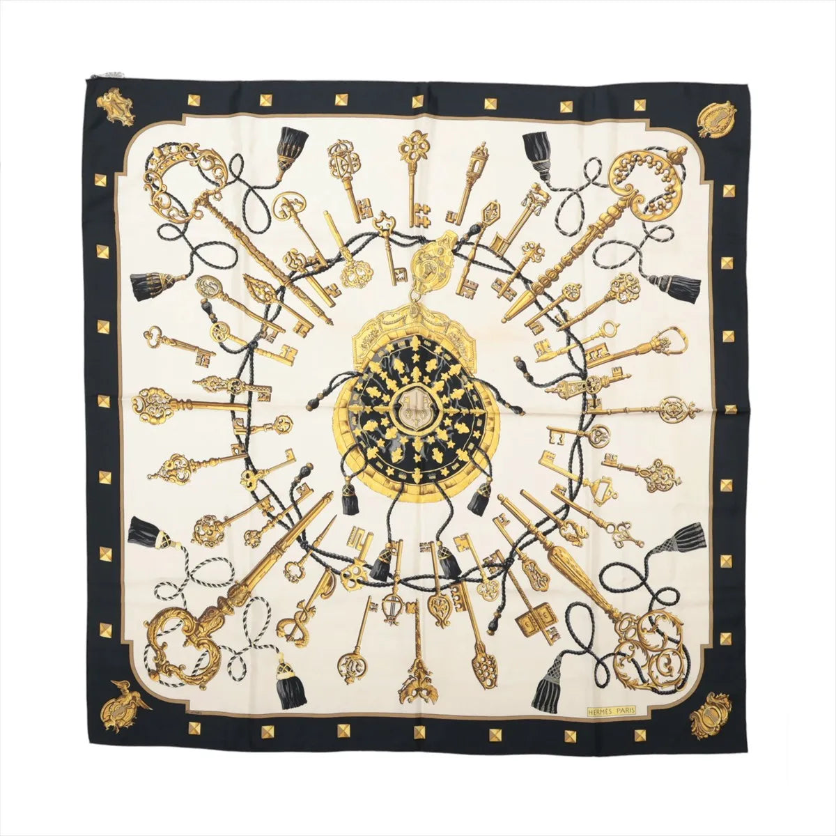 Hermès Carré 90 Les Clés silk scarf with black border, ivory center, ornate gold key motifs, black tassels and gold stud details.