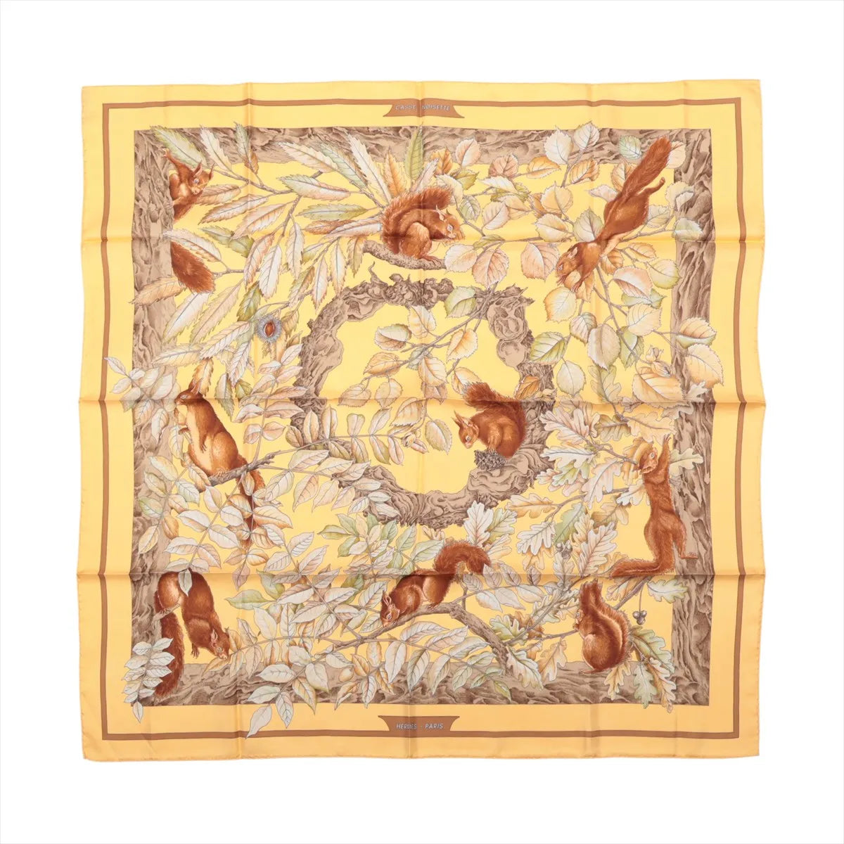 Hermès Carré 90 Casse Noisette yellow silk scarf with red squirrels, leafy branches and brown, cream and green botanical details.