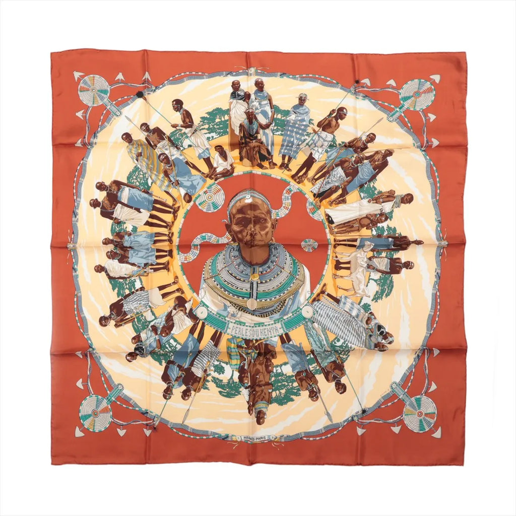 Hermès Carré 90 Perles du Kenya silk scarf with brown border, central portrait, surrounding figures and turquoise, cream and gold details.