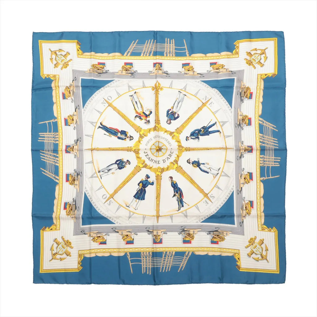 Hermès Carré 90 blue silk scarf with circular nautical design, uniformed figures, gold ornamental details and white geometric panels.