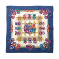 Hermès Carré 90 Les Rubans du Cheval silk scarf with navy border, ivory center, multicolor ribbon rosettes, bows and gold harness motifs.